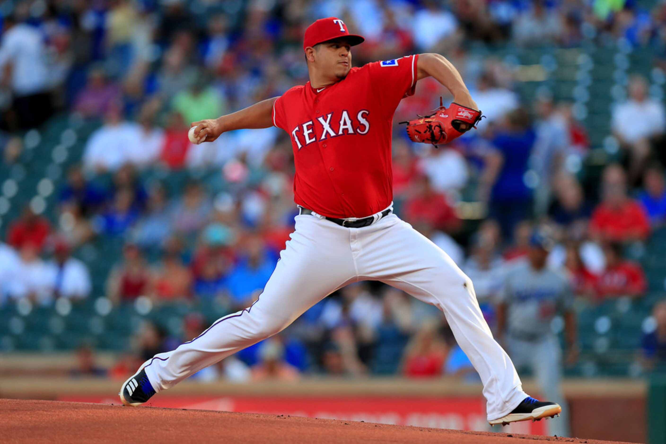 ARLINGTON, TX - AUGUST 28:  Ariel Jurado #57 of the Texas Rangers pitches against the Los...