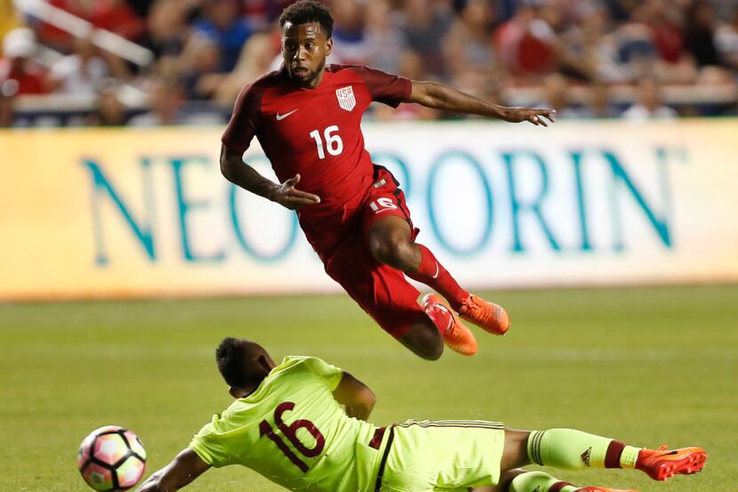 SANDY, UT - JUNE 3: United States midfielder Kellyn Acosta (T) jumps over Venezuela's...