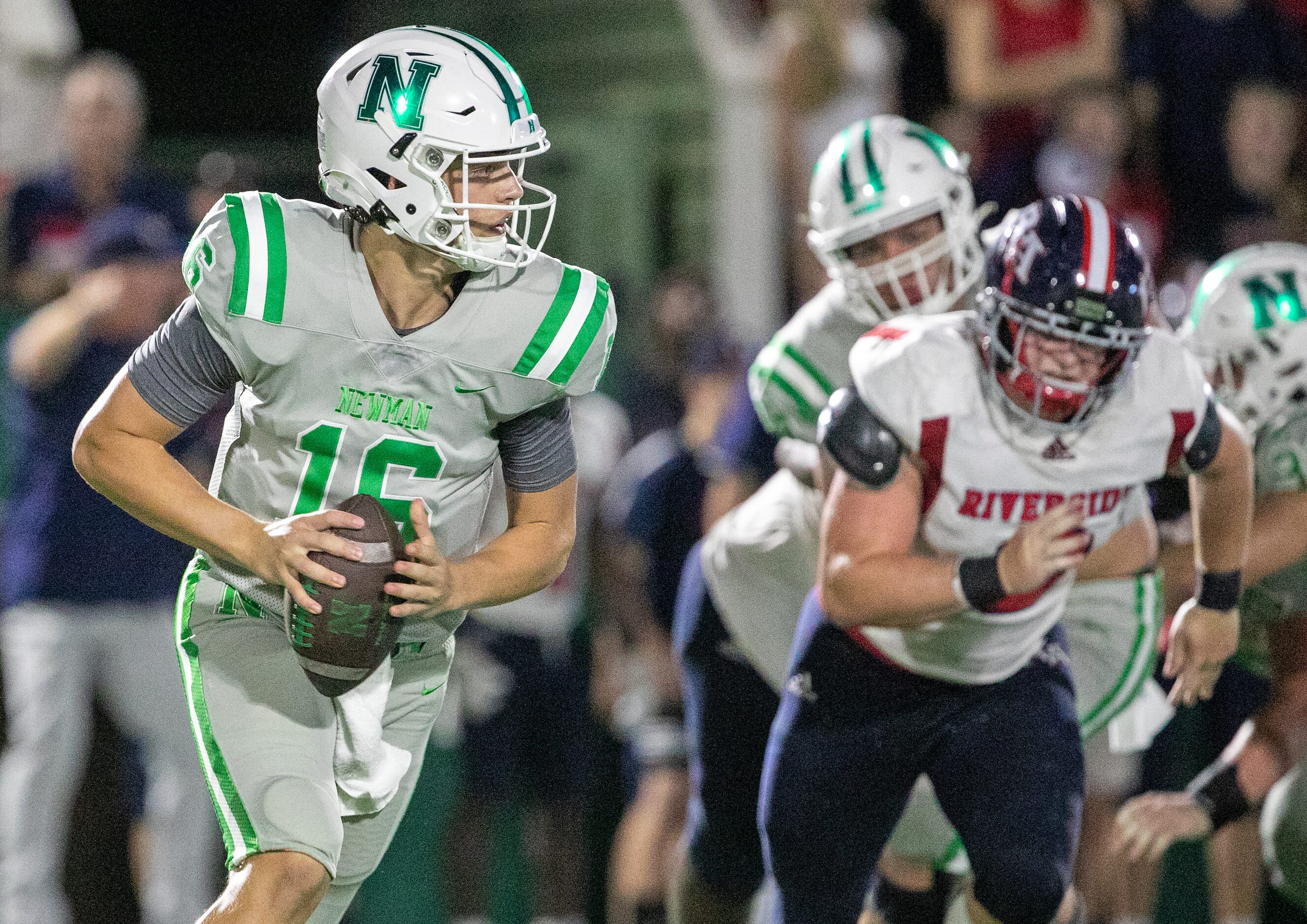 Arch Manning rolls out looking for a receiver as Newman High School takes on Riverside...