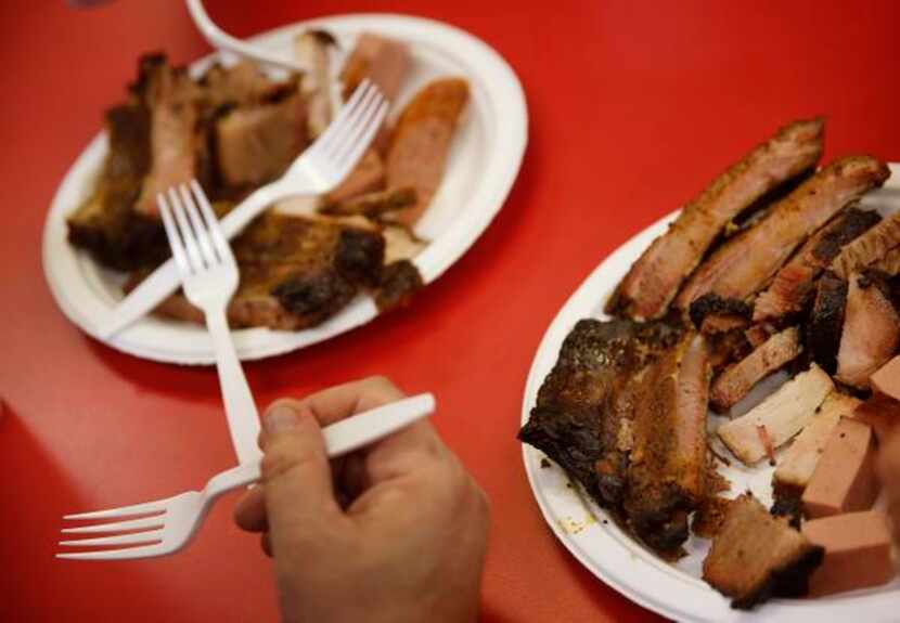 
Plates full of smoked brisket, ribs, sausage and even bologna are served up at Lazy S&M BBQ...