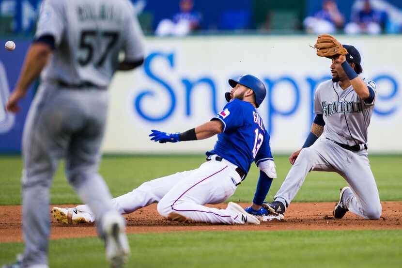 Texas Rangers center fielder Joey Gallo (13) is safe with a double after Seattle Mariners...