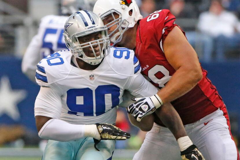Dallas defensive end DeMarcus Lawrence (90) is blocked by Arizona Cardinals tackle Jared...