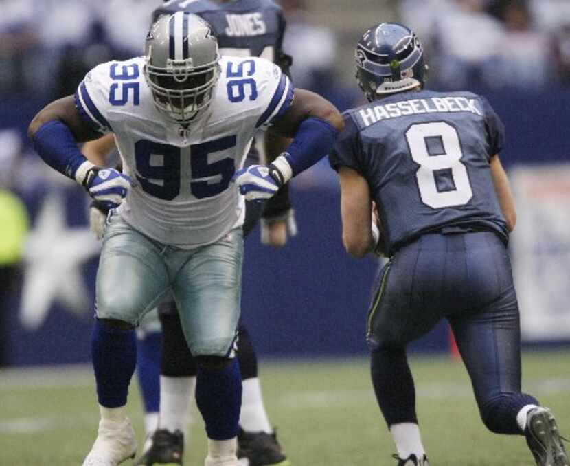 Cowboys' Tank Johnson gets up flaying his arms like a Turkey after sacking Seahawks...