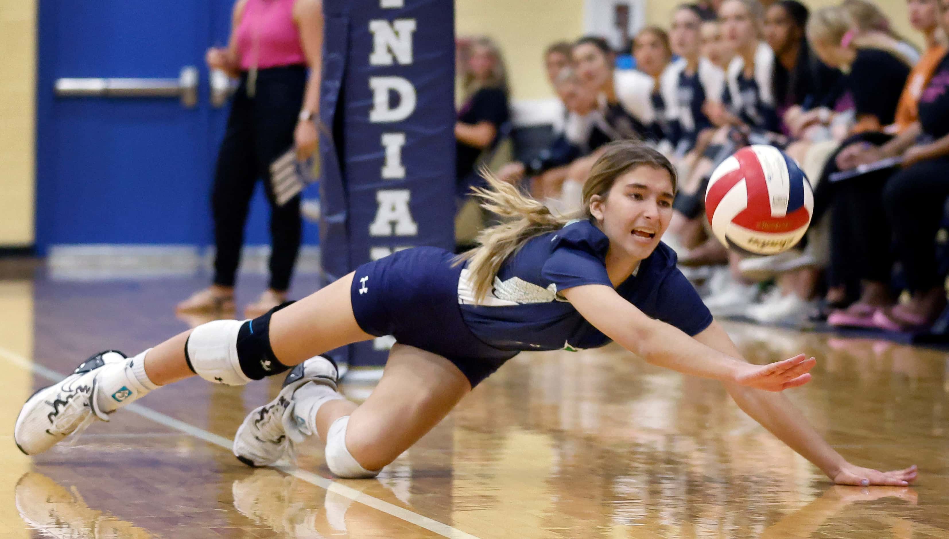 Eaton High setter Keeley Shearer (1) dives in attempt to save a Keller High volley during...