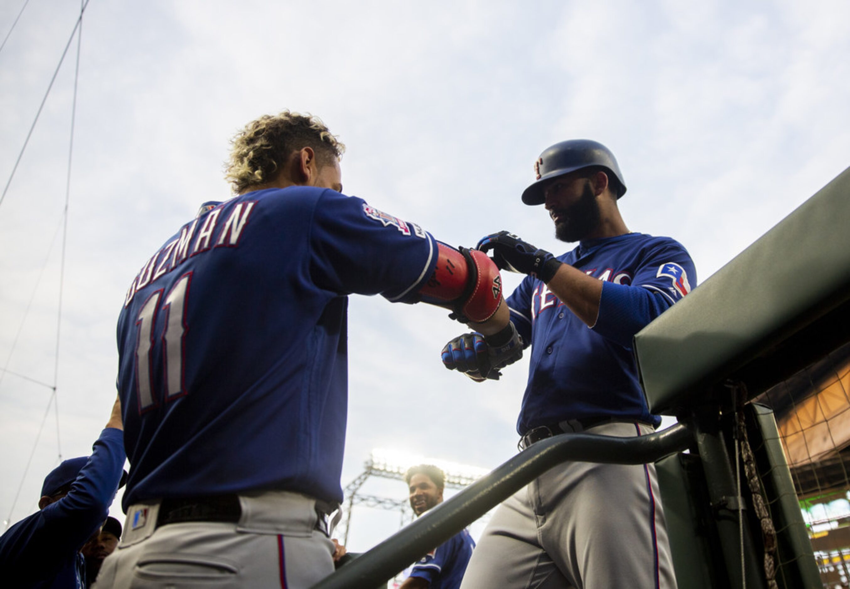 SEATTLE, WA - MAY 28:  Ronald Guzman #11 of the Texas Rangers greets Nomar Mazara #30 of the...