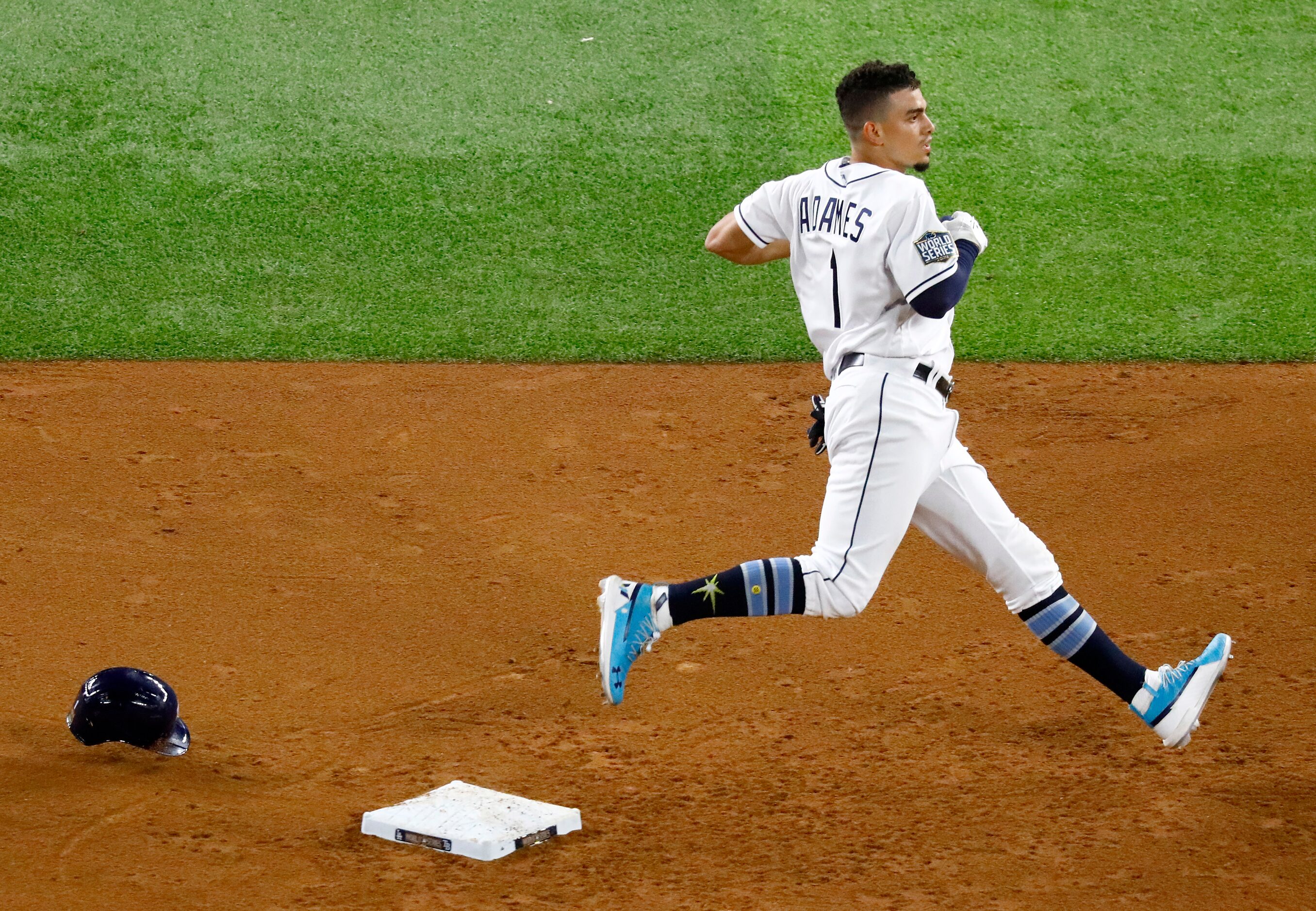 Tampa Bay Rays batter Willy Adames (1) looses his helmet after hitting a double against the...