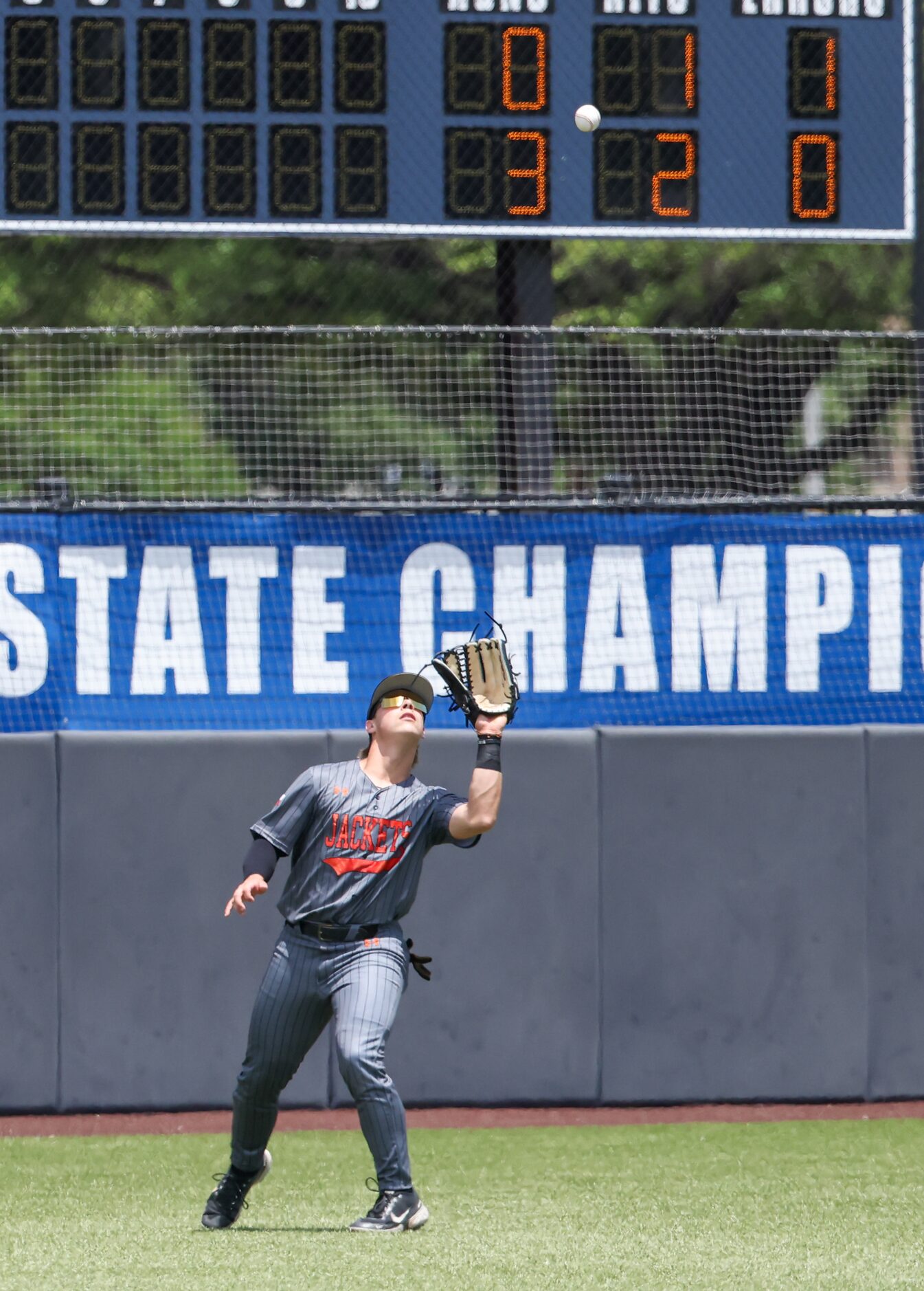 Rockwall junior Jake Overstreet makes a catch, adding an out to Mansfield during an area...