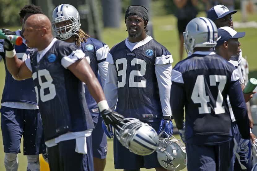 Dallas Cowboys defensive line Cedric Thornton (92) and defensive players take a break on the...