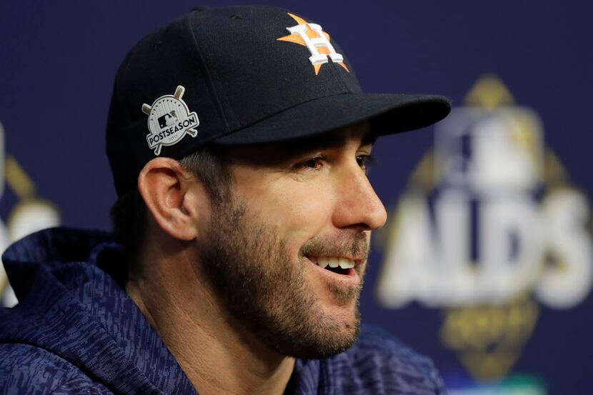 Houston Astros starting pitcher Justin Verlander talks to the media before a practice for...