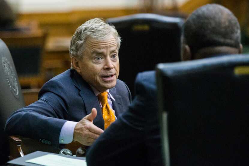 State Sen. Don Huffines talked to Senator Royce West during a midnight session during the...