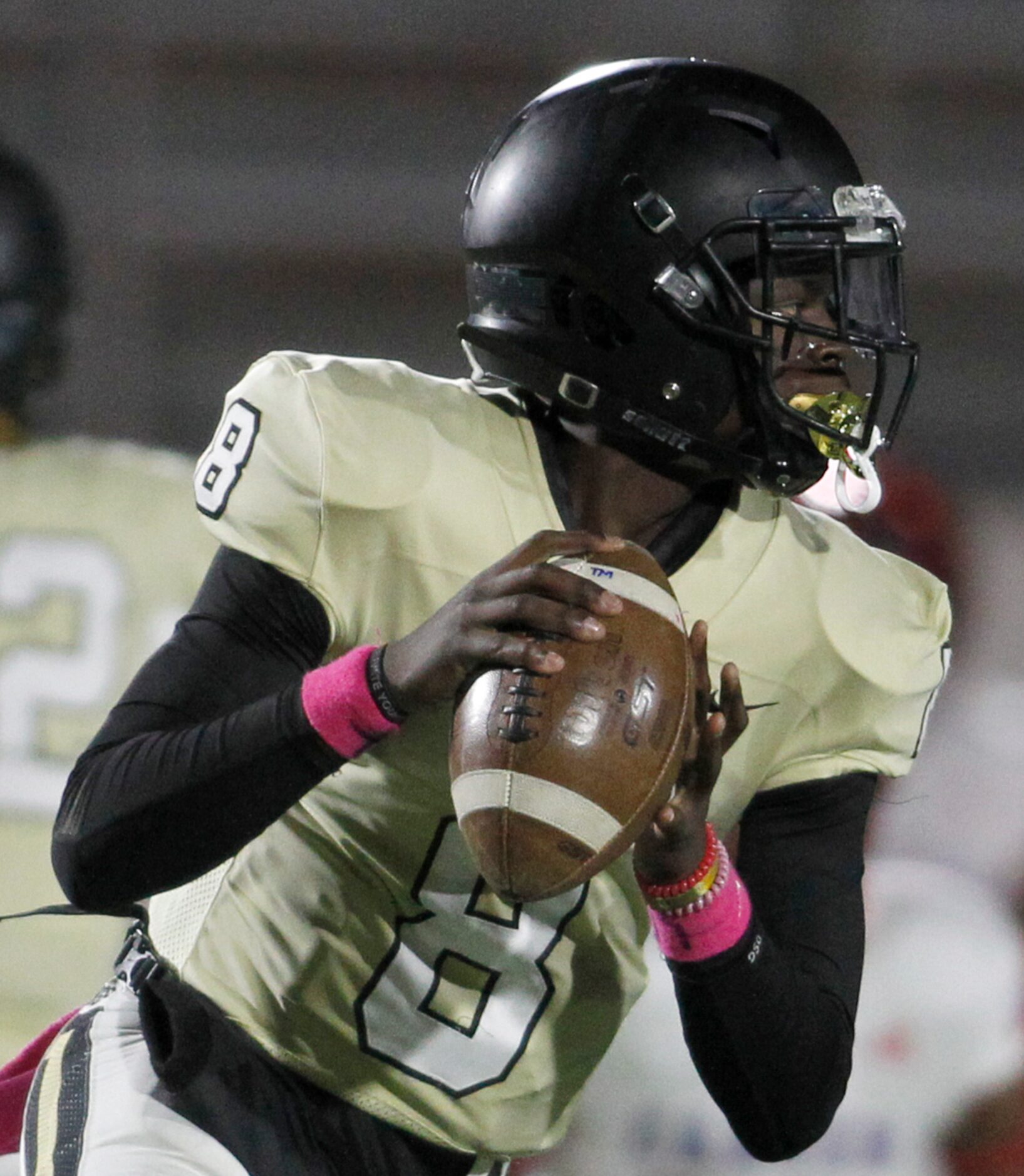 Dallas Pinkston quarterback Camyri Childress (8) looks for a receiver during first half...