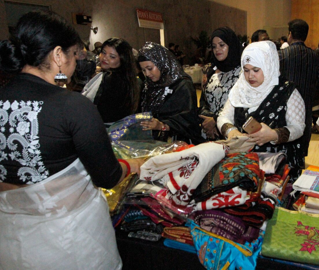 Attendees shop for fabric at  the  International Mother Language Day on Feb. 24 at DFW...