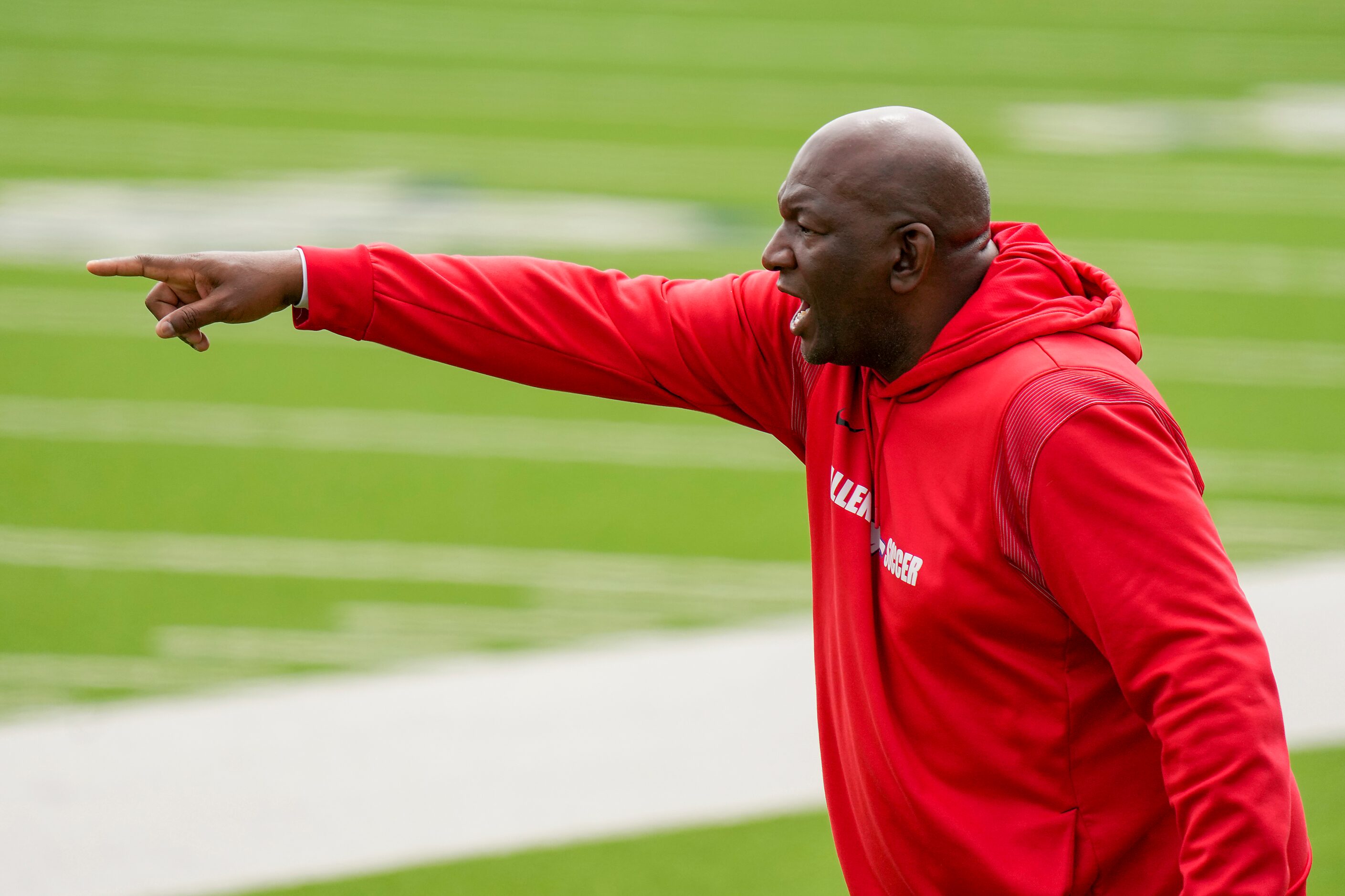 Allen coach Kim Fullerton directs his team during the first half of the Class 6A Region I...