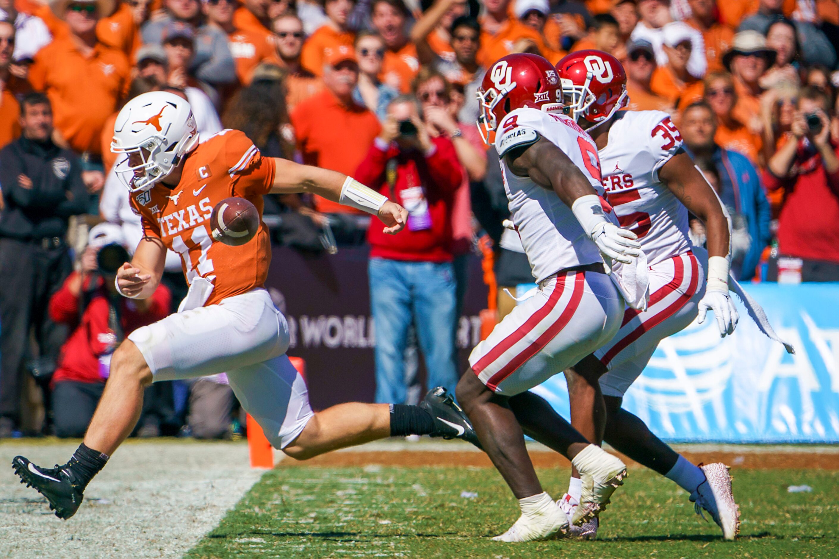 Texas quarterback Sam Ehlinger (11) is called for intentional grounding as he tries to toss...