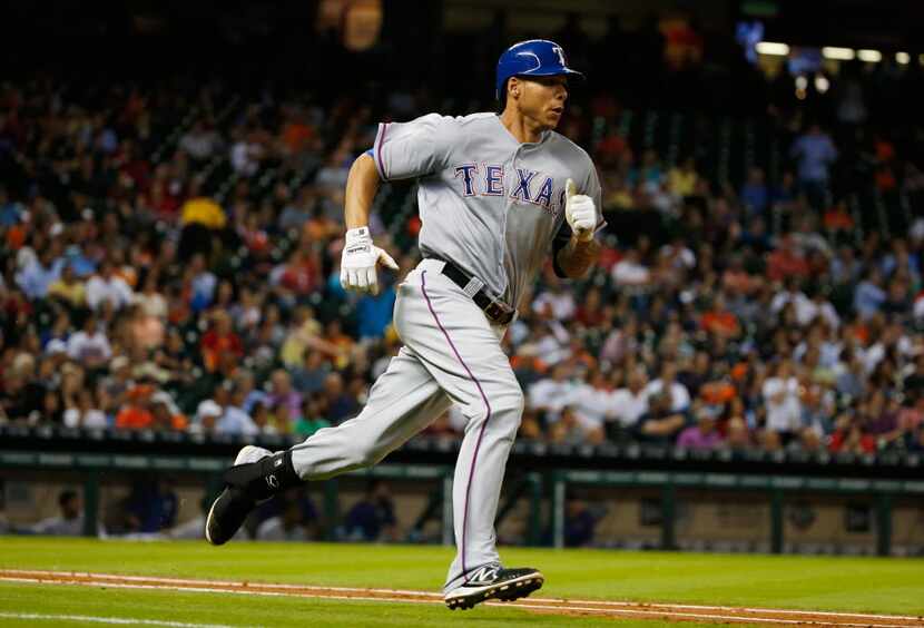 Kyle Blanks #88 of the Texas Rangers rounds the bases after a solo home run in the fifth...