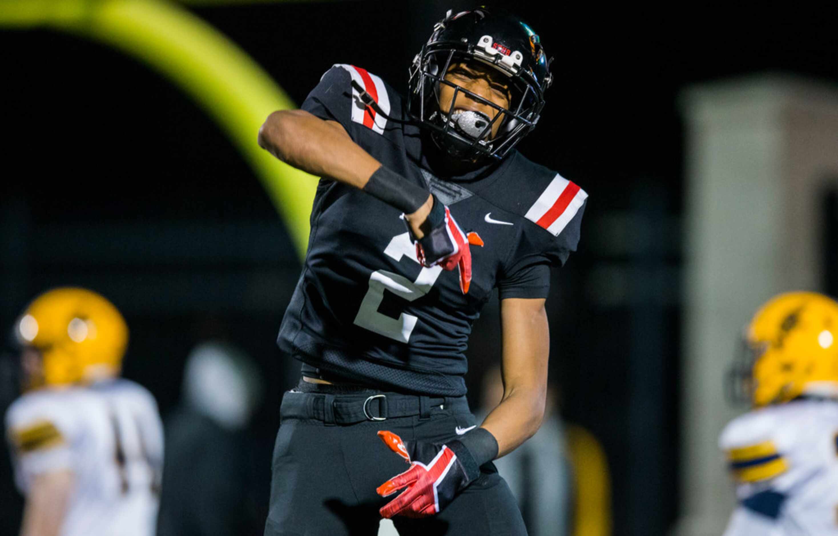 Euless Trinity running back Ollie Gordon (2) celebrates after running to the end zone for a...