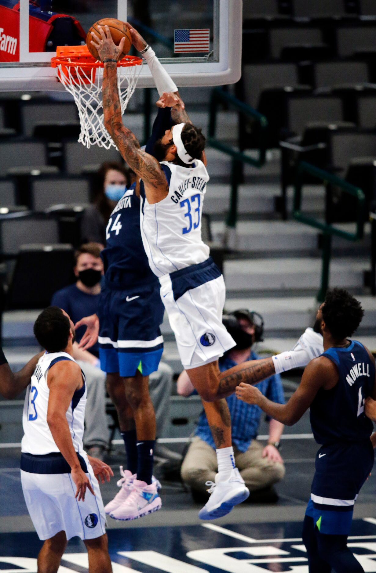 Dallas Mavericks center Willie Cauley-Stein (33) skies over a Minnesota Timberwolves player...