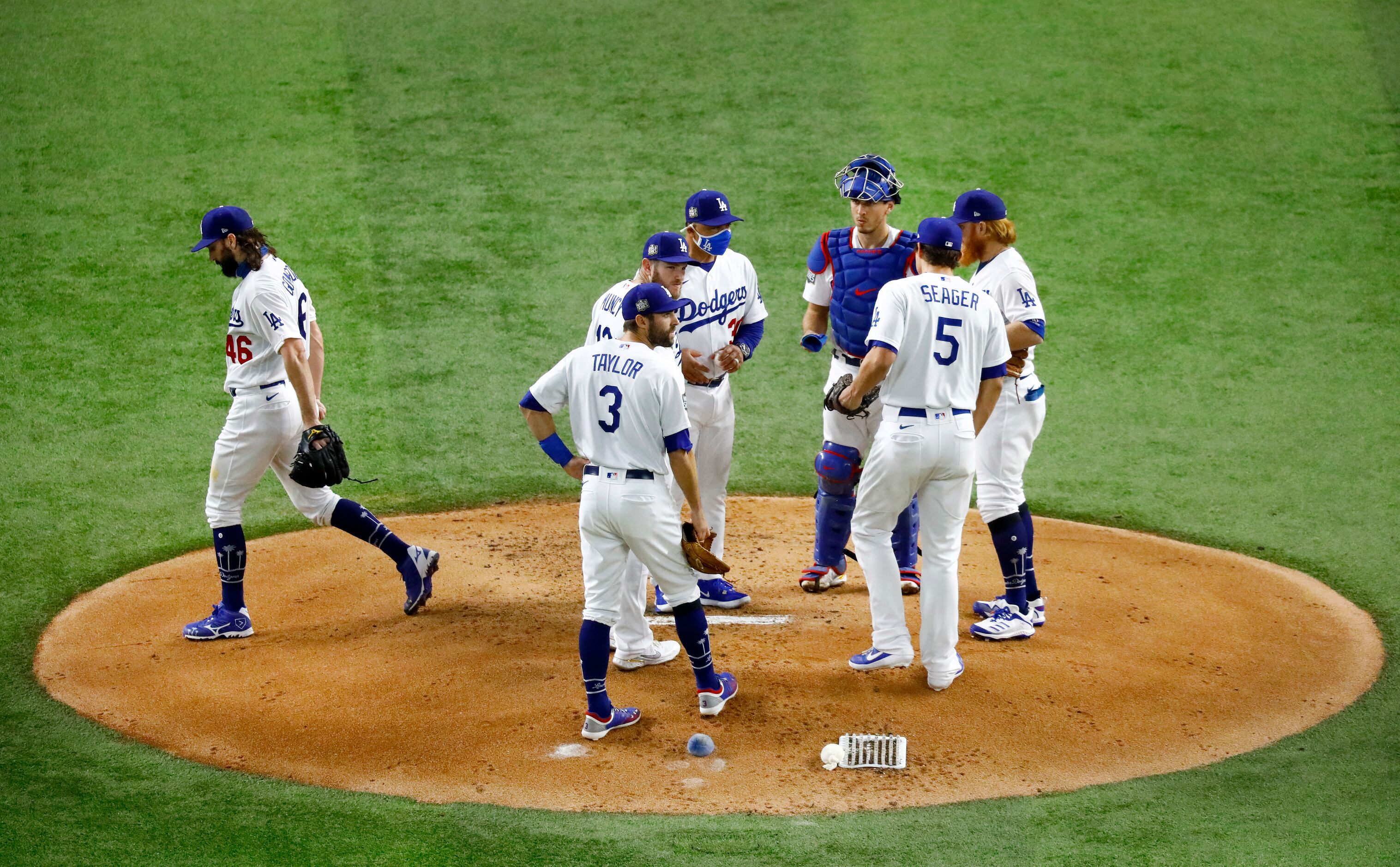 Los Angeles Dodgers starting pitcher Tony Gonsolin (46) heads to the dugout after being...