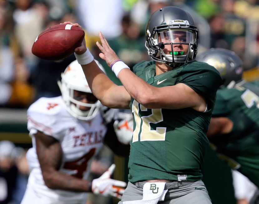 FILE - In this Oct. 28, 2017, file photo, Baylor quarterback Charlie Brewer throws downfield...