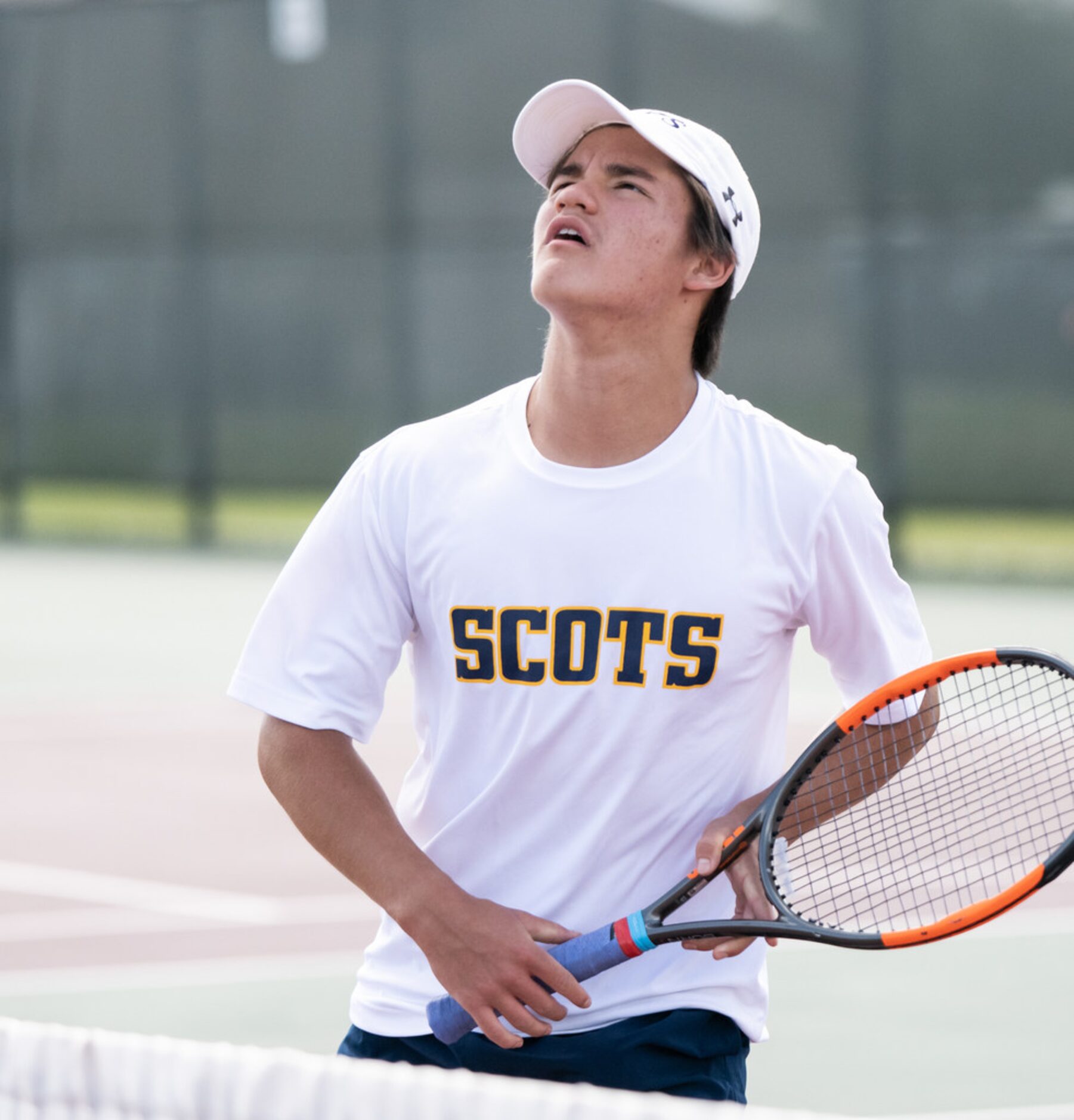 Highland Park's Mikhail Commer waits to return the ball in a doubles match with teammate Ray...