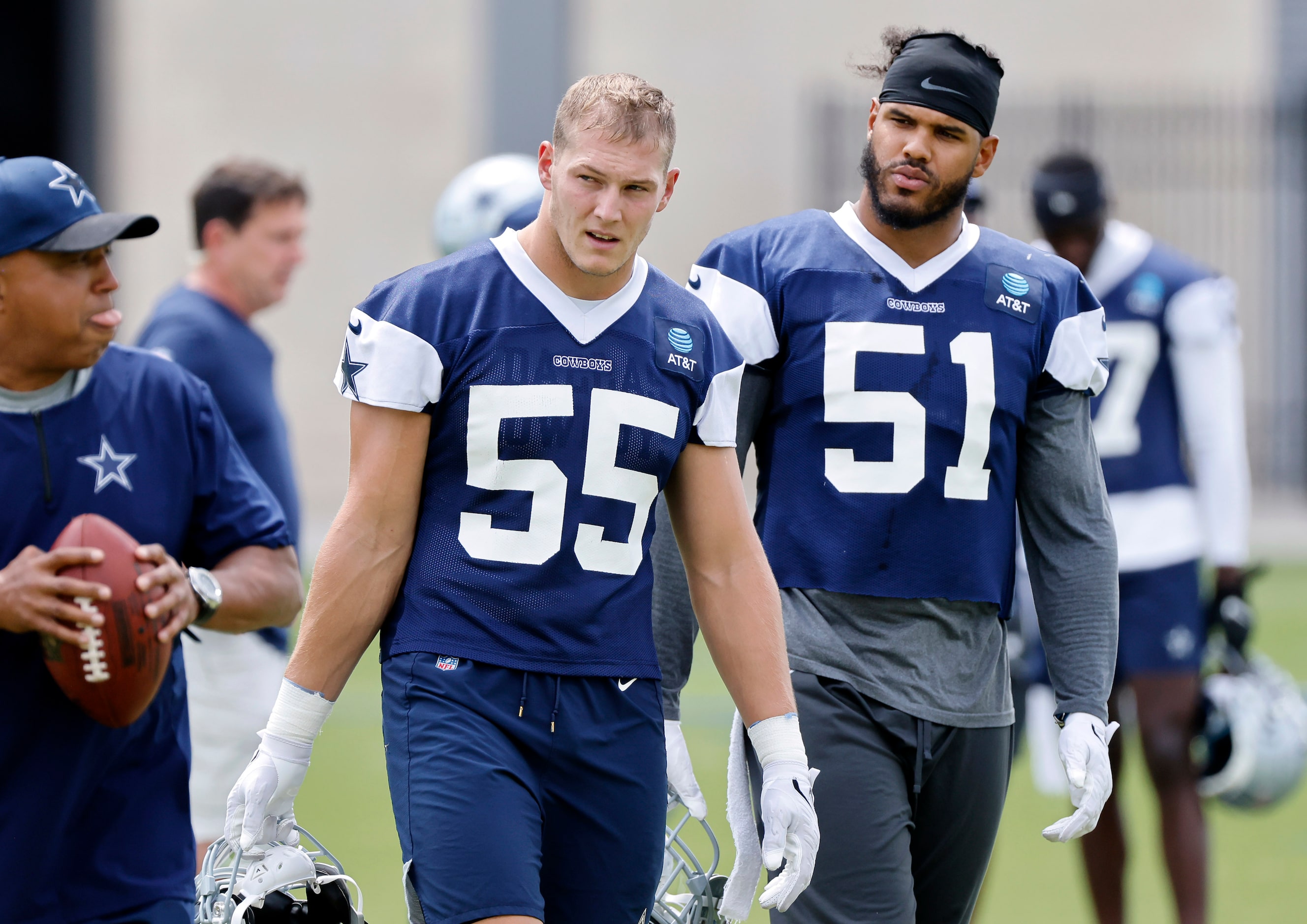 Dallas Cowboys linebackers Leighton Vander Esch (55) and Anthony Barr (51) walk to the next...