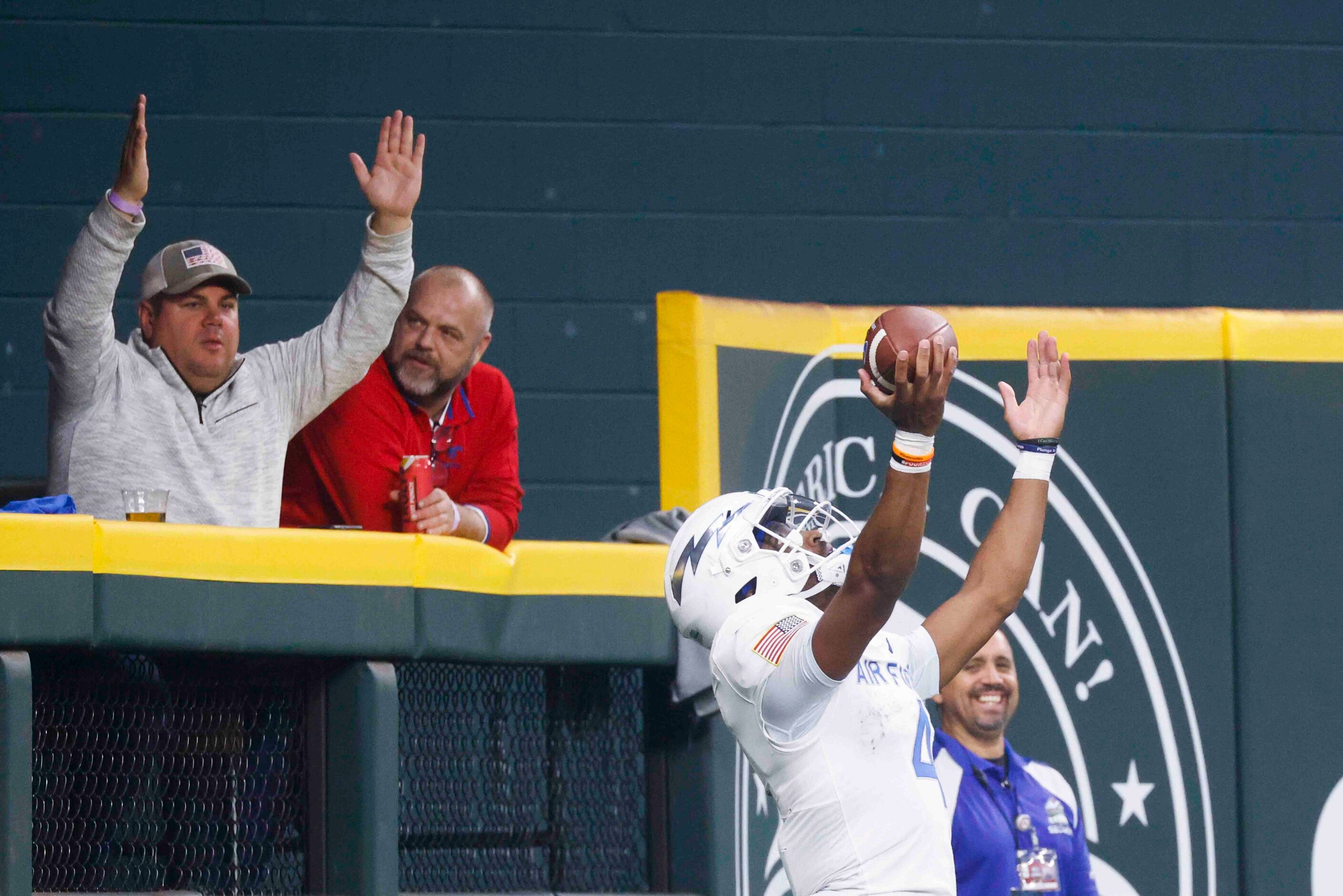 Air Force quarterback Haaziq Daniels (4) celebrates a touchdown during the second half of an...