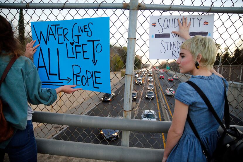 Protesters stopped over the North Dallas Tollway to share their feelings with drivers about...