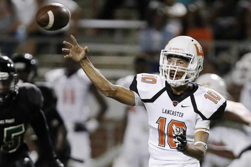 Lancaster senior quarterback Ryan Ross (10) throws to a teammate during the first  half of a...