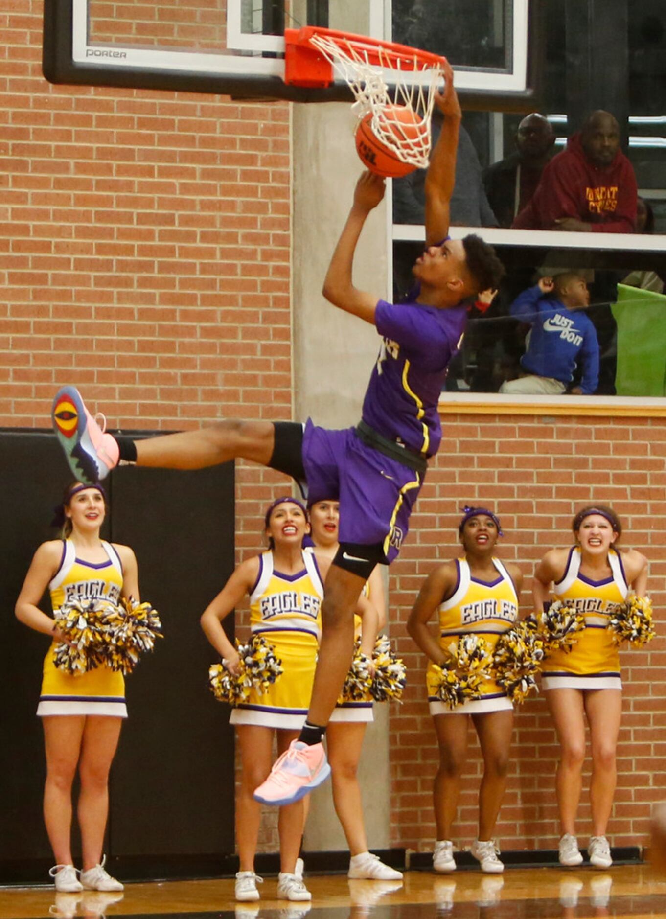 Richardson guard Rylan Griffen (3) finishes off an uncontested dunk to the anticipated...