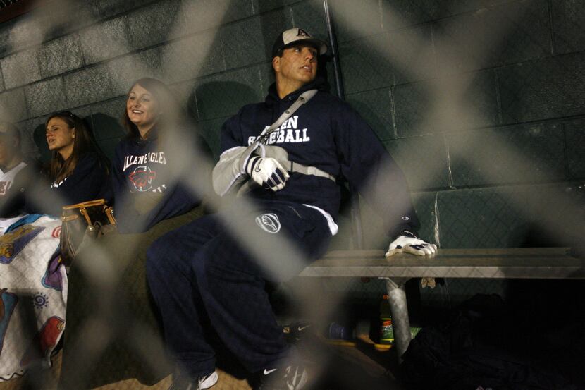 ORG XMIT: *S18CA8214* Allen High's Shawn Tolleson (middle) sits in the dugout with his arm...