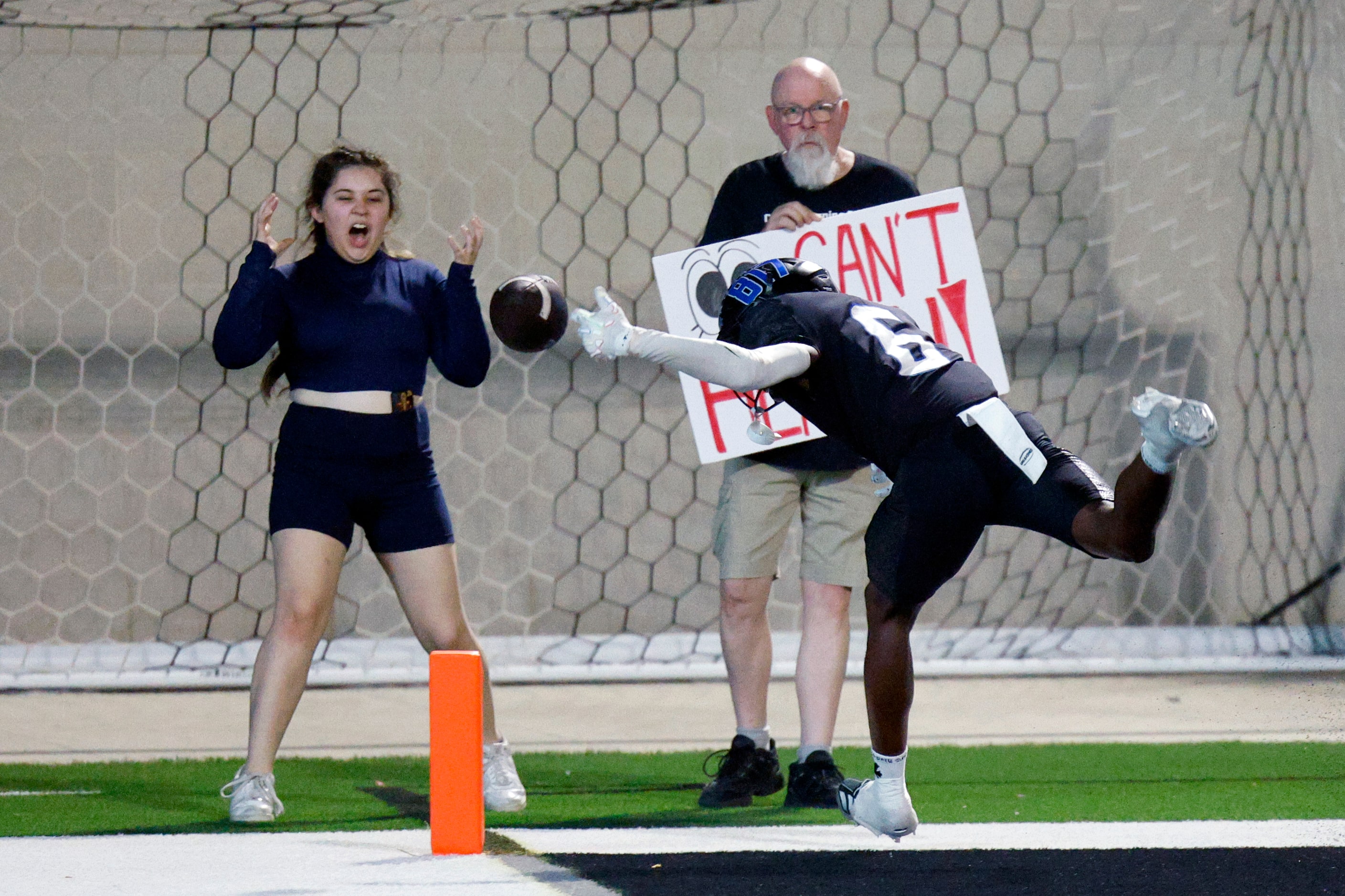 A fan reacts after North Crowley wide receiver Quentin Gibson (6) drops a pass in the end...