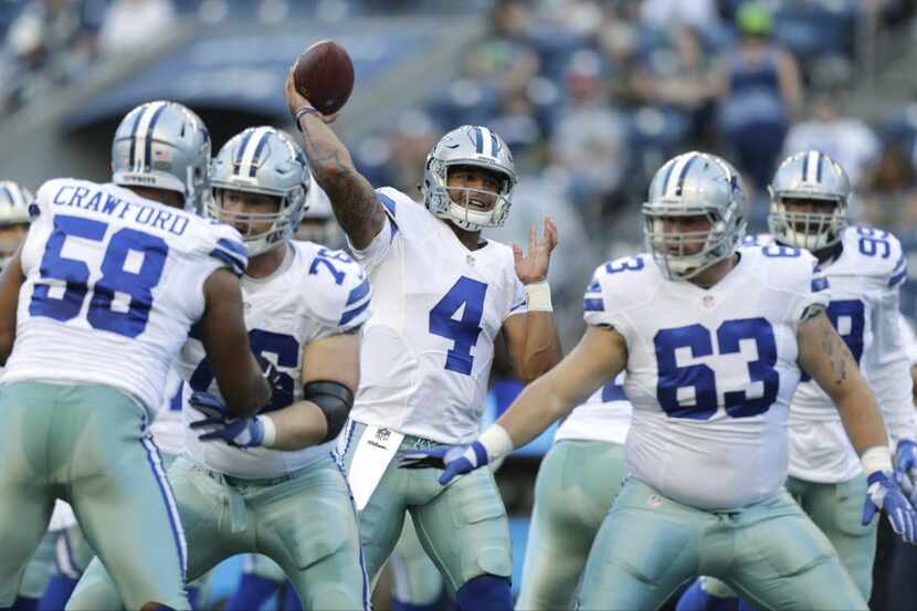 Dallas Cowboys quarterback Dak Prescott (4) passes during warmups before a preseason NFL...