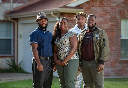 Sammie Anderson with her sons: Sam Bible, left; Tyrone Anderson, third from left; and Grant...