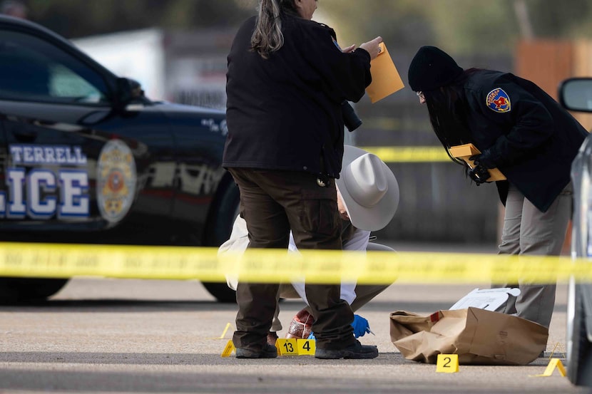 Evidence markers mark the scene as Kaufman County Sheriff investigate where Terrell police...