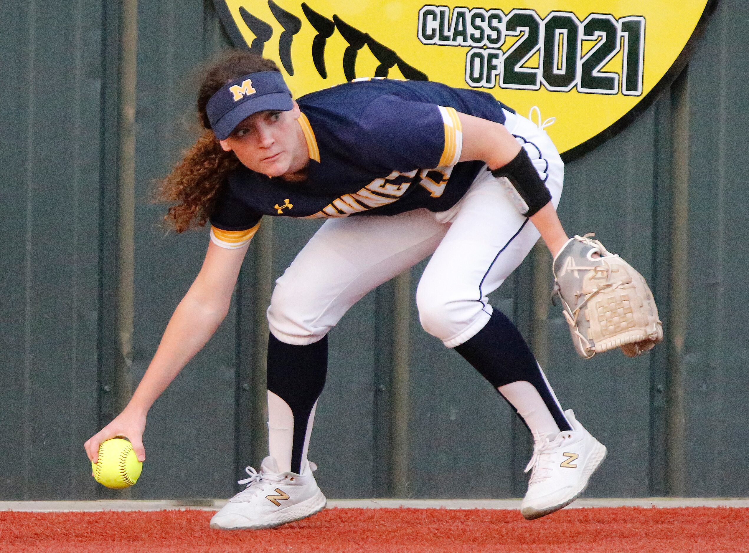 McKinney High School left fielder Payton James (11) readies to throw in a base hit in the...