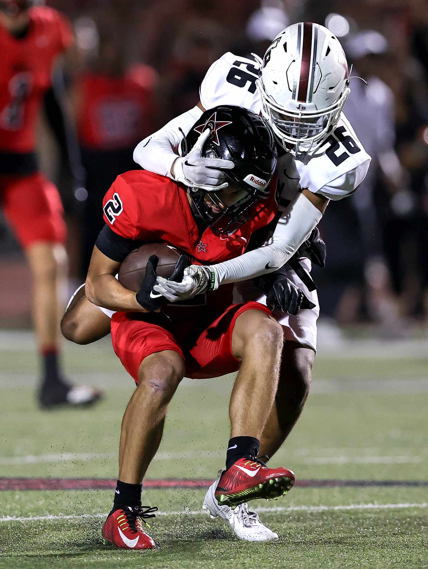 Coppell wide receiver Luca Grosoli (2) makes a reception and is brought down by Lewisville...
