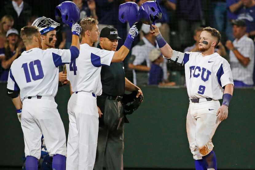 TCU catcher Evan Skoug (9) arrives at home plate after his 3-run home run in the eighth...
