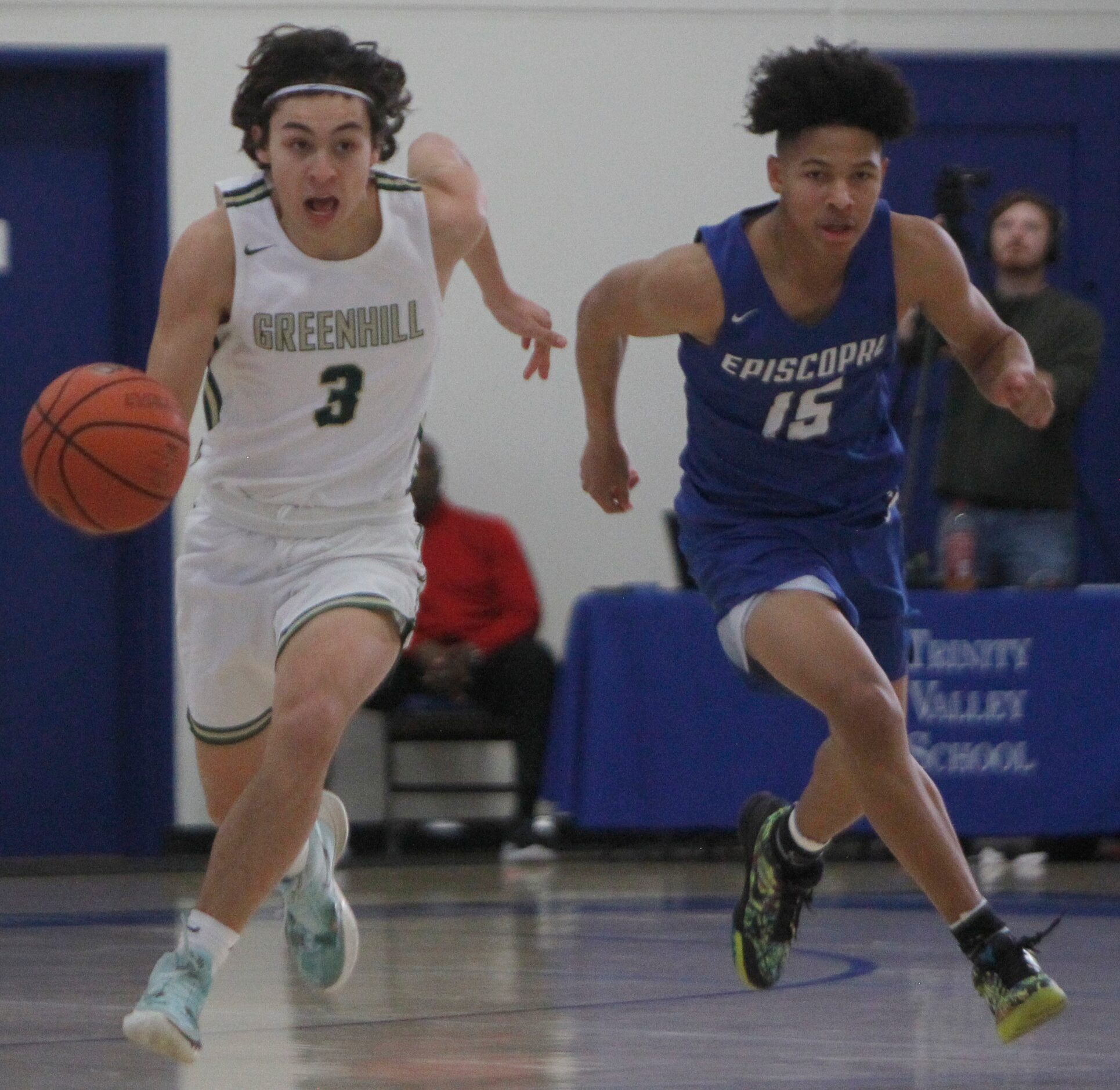 Greenhill's Ryan Saqueton (3) dribbles the ball alongside the defense of Houston Episcopal's...