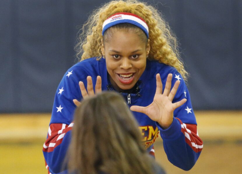 The Harlem Globetrotters' Joyce "Sweet J" Ekworomadu demonstrates a good ready stance for...