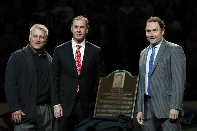 Former Dallas Stars goalie Ed Belfour stands by a plaque with former teammates Joe...