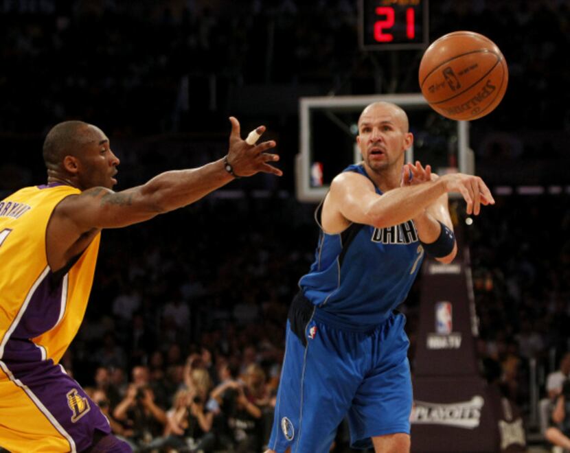 Dallas' Jason Kidd (right) passes against Los Angeles' Kobe Bryant during Game 2 of their...