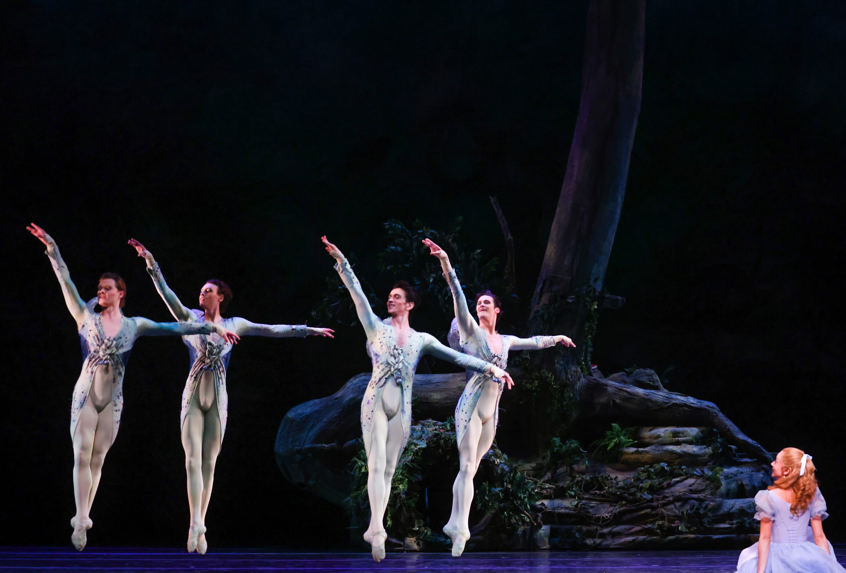 Alice (Alexandra F. Light, center) admires a swarm of butterflies and dragonflies after...