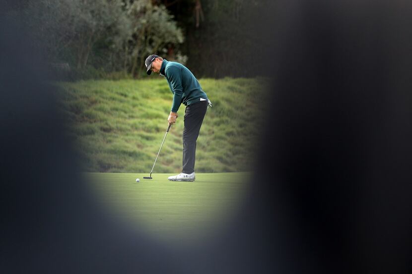PACIFIC PALISADES, CALIFORNIA - FEBRUARY 15: Jordan Spieth hits a putt on the 8th hole green...