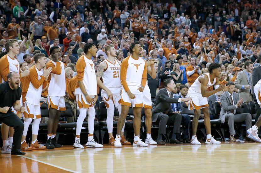 AUSTIN, TX - DECEMBER 9: The Texas Longhorns bench reacts as they defeat the Purdue...