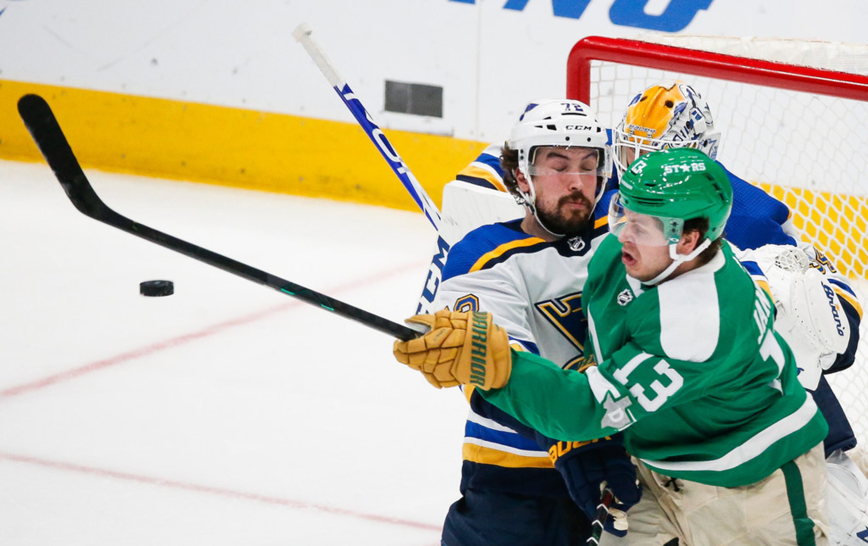 Dallas Stars center Mattias Janmark (13) and St. Louis Blues defenseman Justin Faulk (72)...