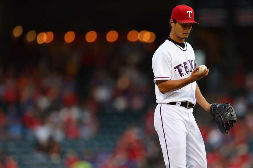 Yu Darvish of the Texas Rangers throws against the Minnesota Twins in the first inning at...