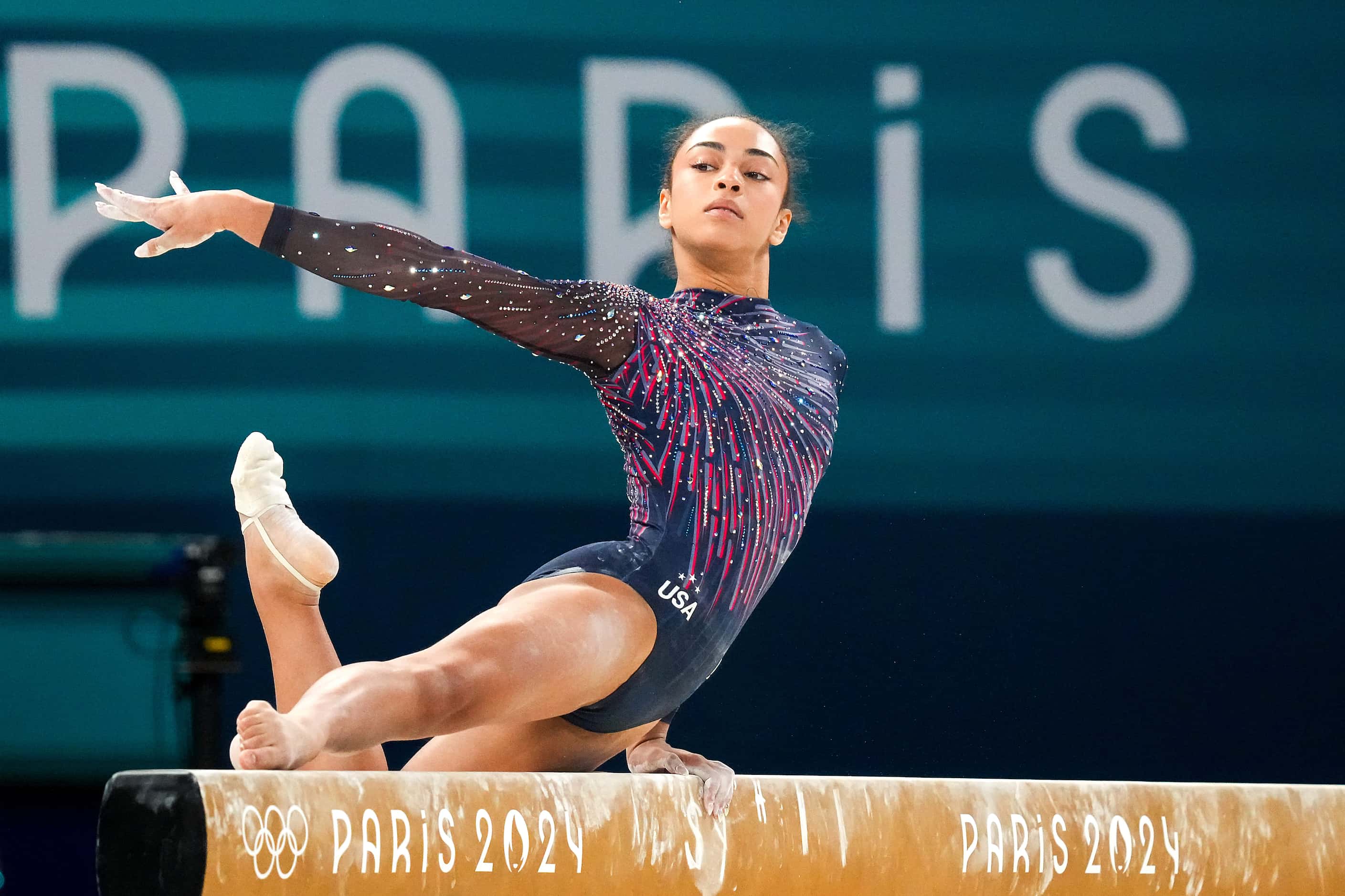 Hezly Rivera of the United States practices on the balance beam during women’s gymnastics...