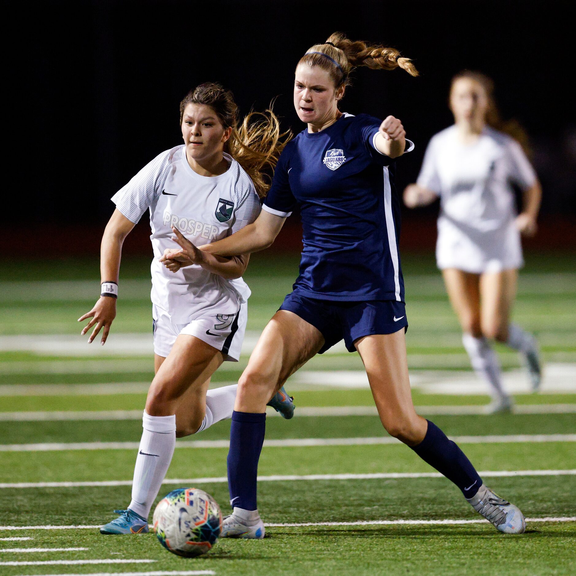 Flower Mound back Audrey Varney (19) defends against  Prosper forward Brooklyn Miller (9)...