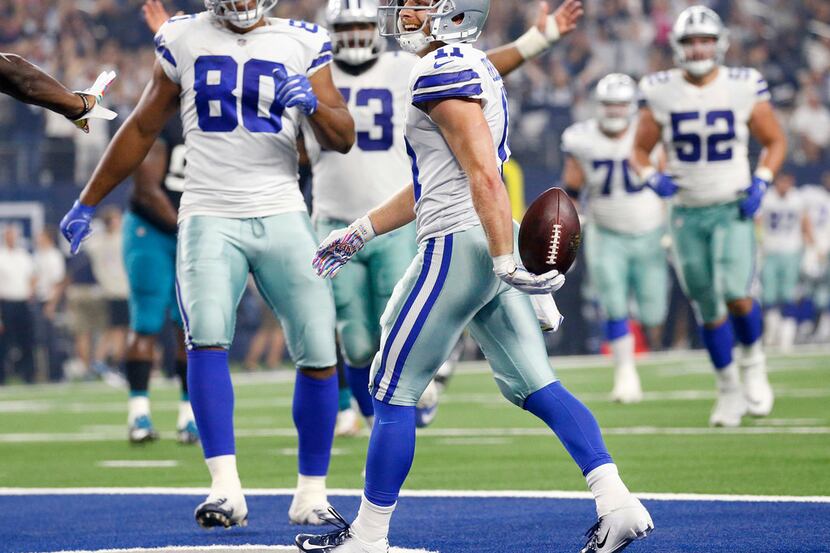 Dallas Cowboys wide receiver Cole Beasley (11) celebrates his second touchdown against the...