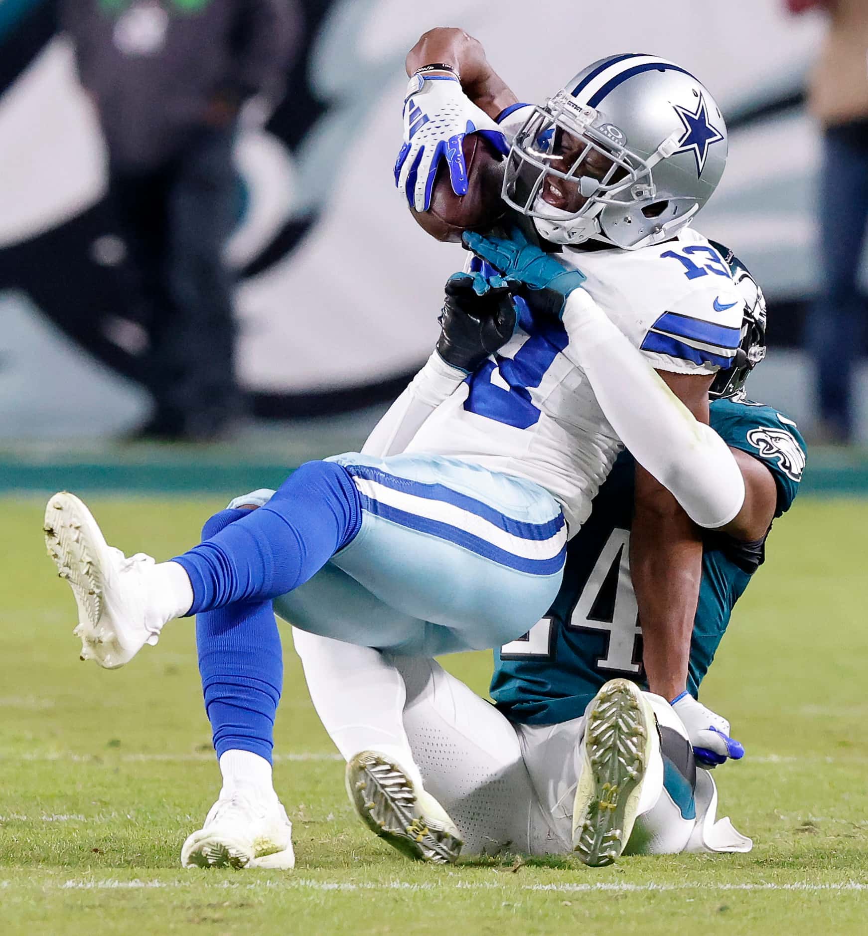 Dallas Cowboys wide receiver Michael Gallup (13) makes a third quarter catch as he’s tackled...